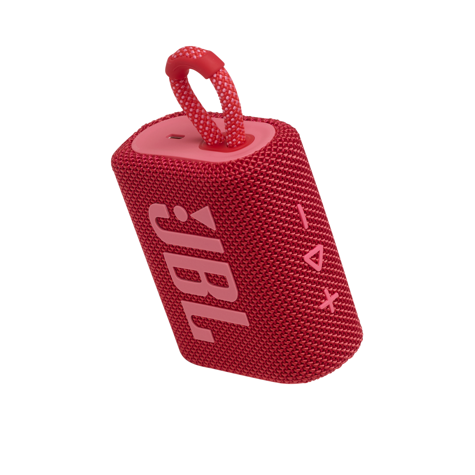 Kırmızı bir JBL hoparlör. Bir tutamağı var. Logo yanda.