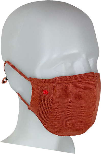 Oranje gezichtsmasker op een witte mannequin hoofd. Rode ster op masker.
