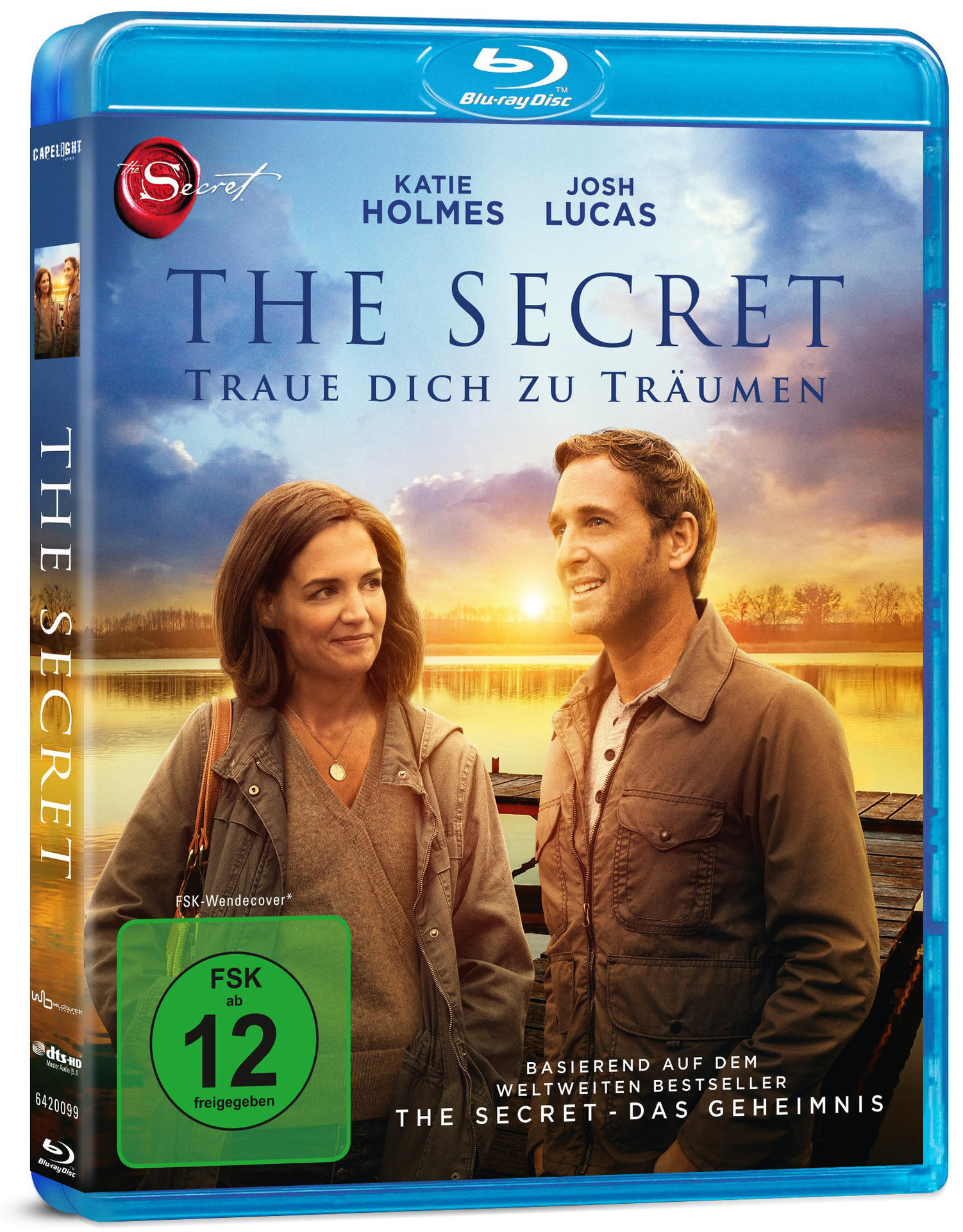 Filmcover von 'The Secret' Blu-ray. Katie Holmes und Josh Lucas stehen bei Sonnenuntergang am See.