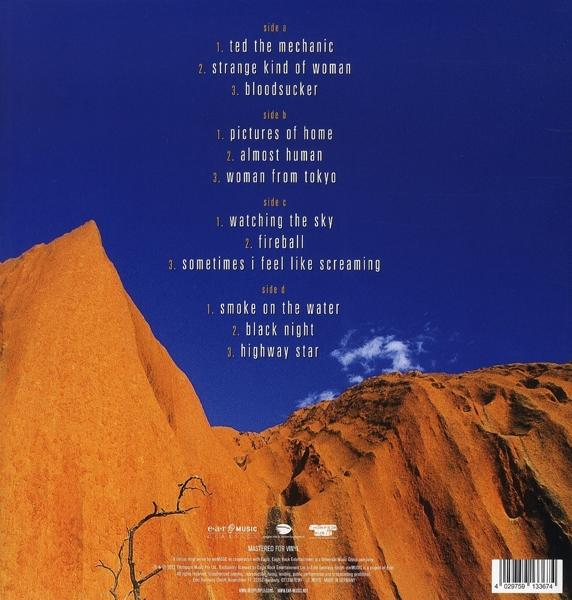 Rückseite eines Musikalbums mit Titelliste und Bergmotiv.