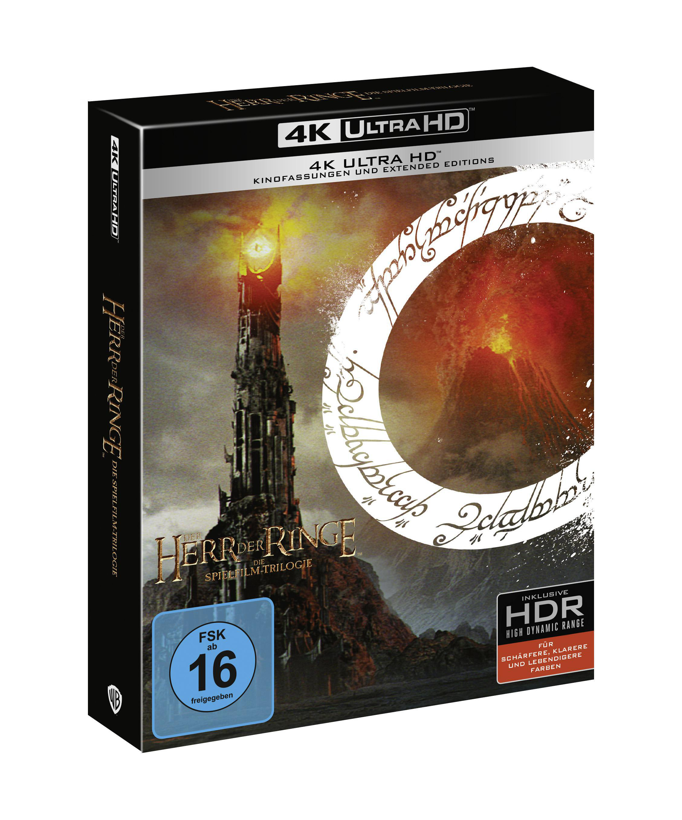 4K Ultra HD Blu-ray Boxset der "Herr der Ringe"-Trilogie. Zeigt den Turm und einen Ring.
