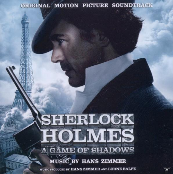 Kalapos férfi fegyvert tart az Eiffel-torony előtt, "Sherlock Holmes" borító.