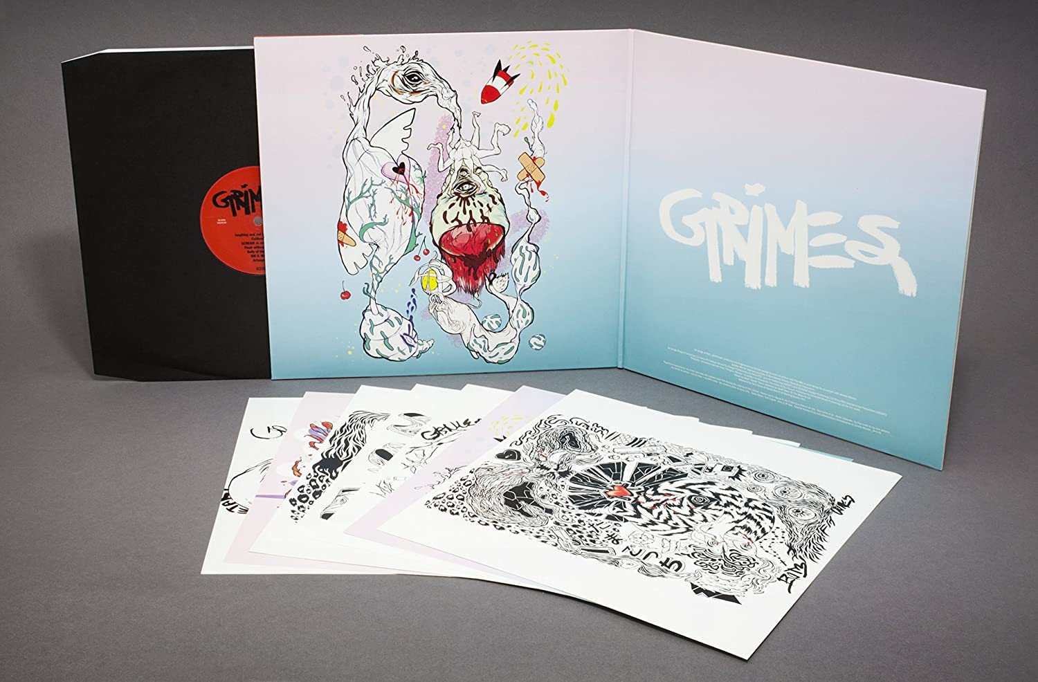 Grimes album borítója színes, absztrakt illusztrációkkal. Vinyl lemez és művészi nyomatok is láthatók.