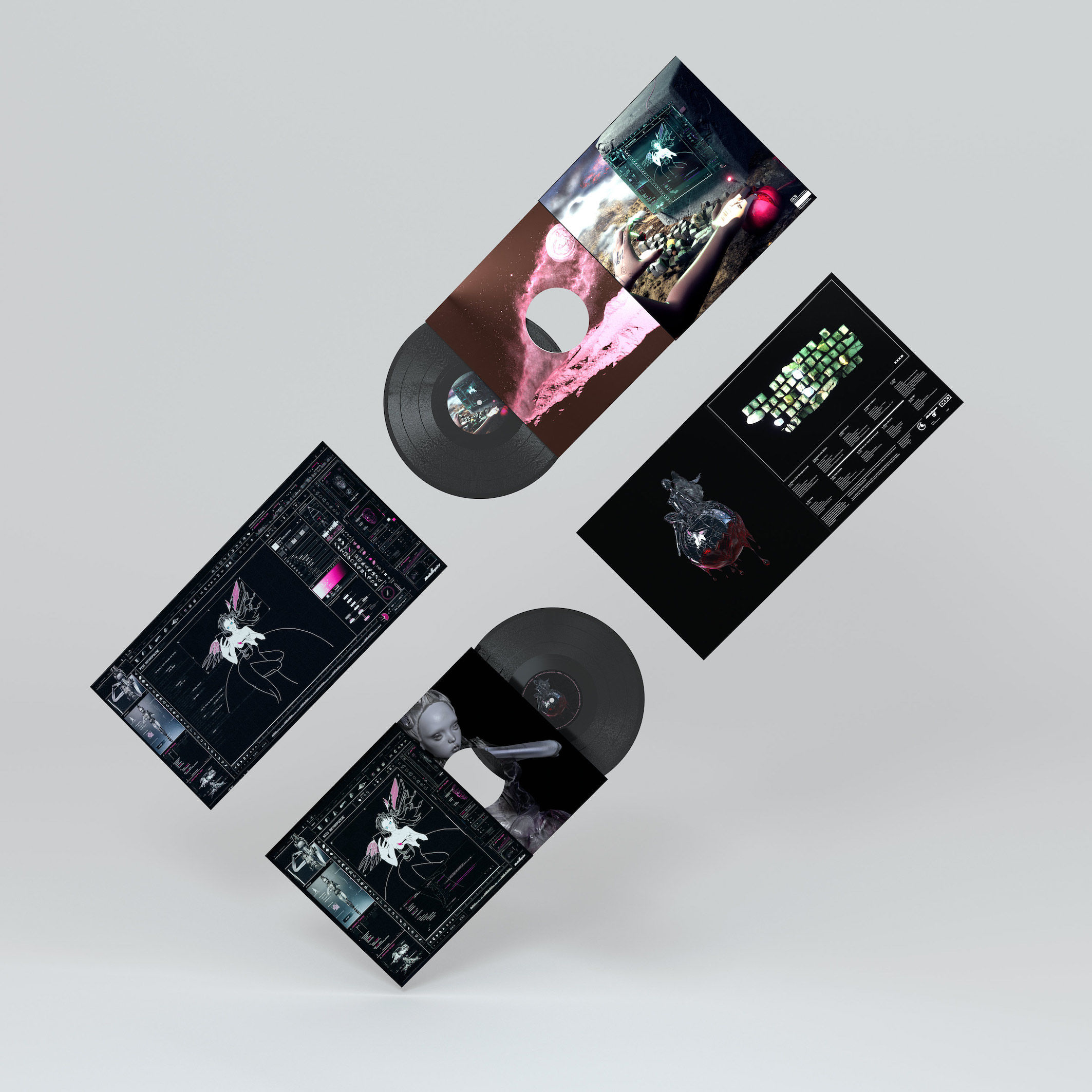 Vinil album műalkotás lemezekkel és betétekkel, világosszürke háttéren lebegve.