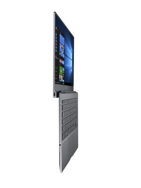 Ein grauer Laptop von der Seite gesehen, Bildschirm im rechten Winkel geöffnet, mit Windows-Benutzeroberfläche.