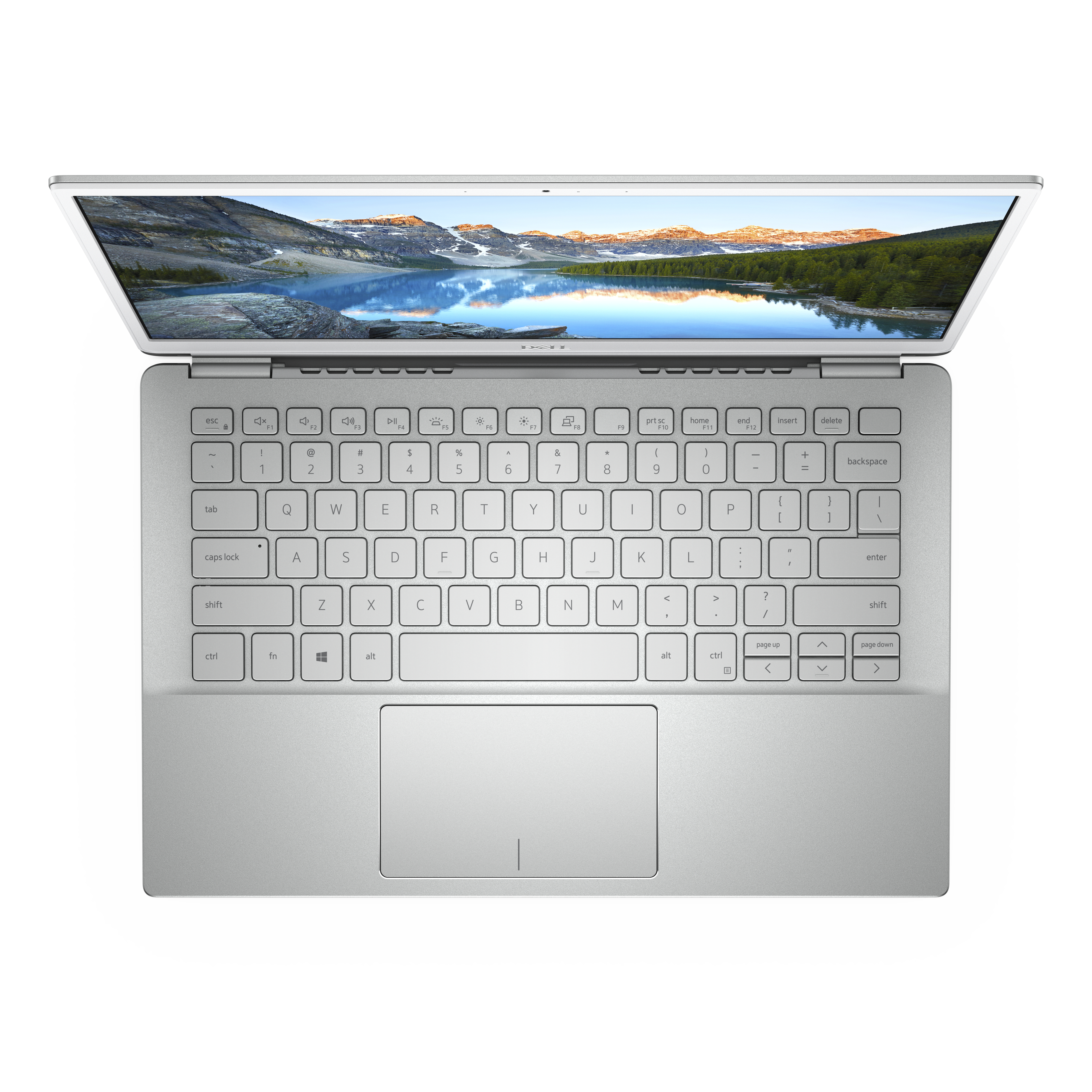 Top-down-Ansicht eines silbernen Laptops mit QWERTZ-Tastatur und Berglandschaft als Hintergrundbild.