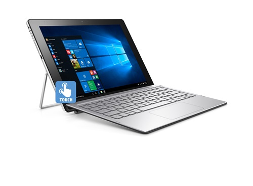 Ein silbernes 2-in-1-Tablet mit Tastatur steht auf einer weißen Oberfläche und zeigt den Windows-Startbildschirm.
