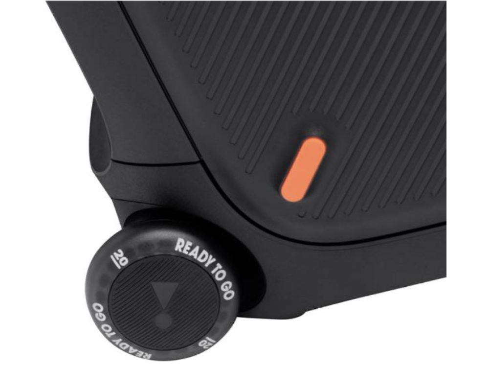 Primer plano de un altavoz negro con un dial de control de volumen etiquetado como 'READY TO GO'.