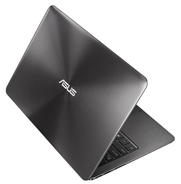 Dunkelgrauer ASUS-Laptop, Draufsicht, Logo sichtbar. Schlankes Design mit gebürsteter Metalloberfläche. Der Bildschirm ist geschlossen.