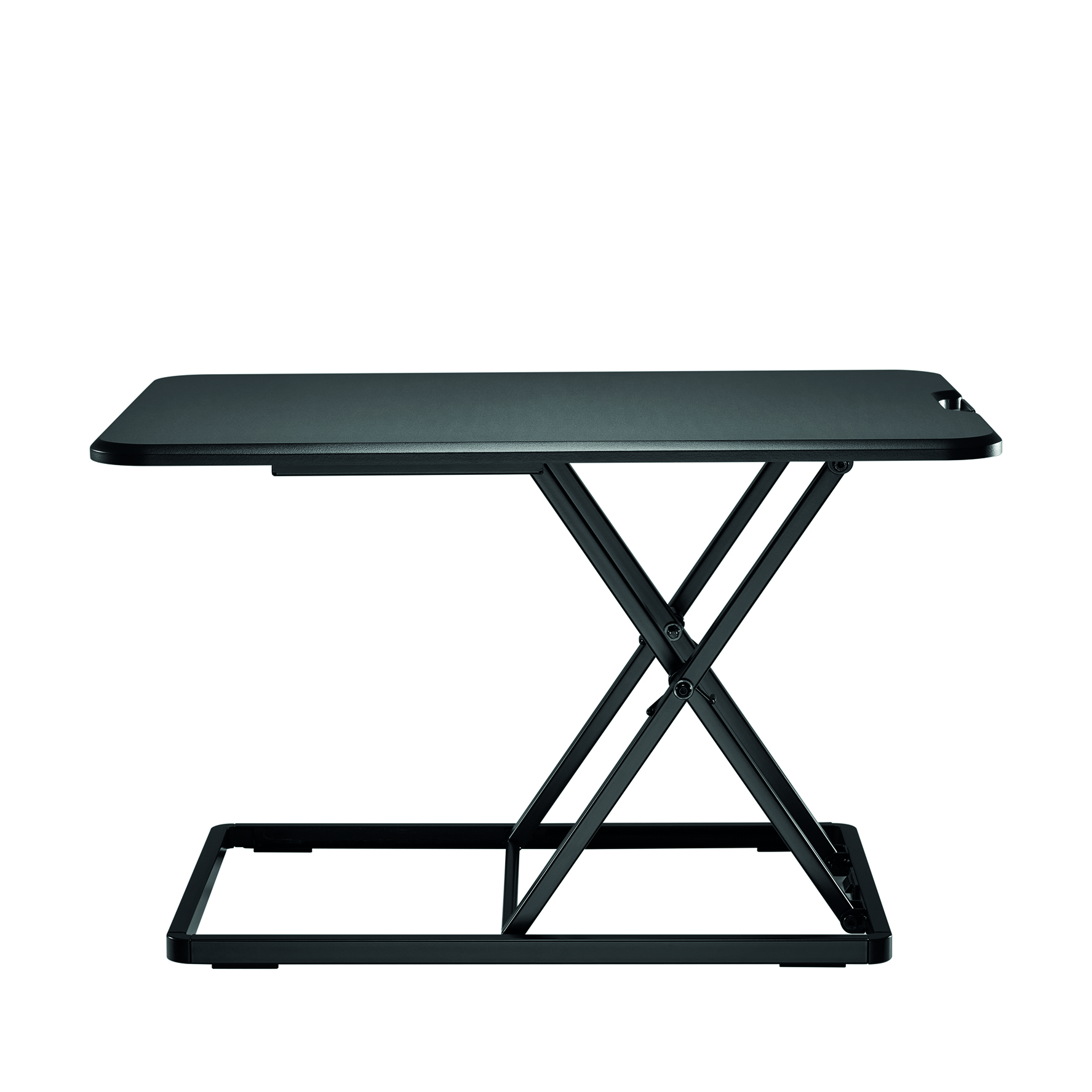 Black standing desk with a foldable frame, viewed from the side, on a white background.
