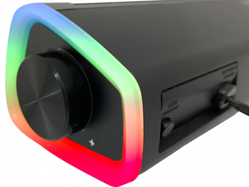 Una barra de sonido negra con una perilla de volumen y una tira de luz multicolor.