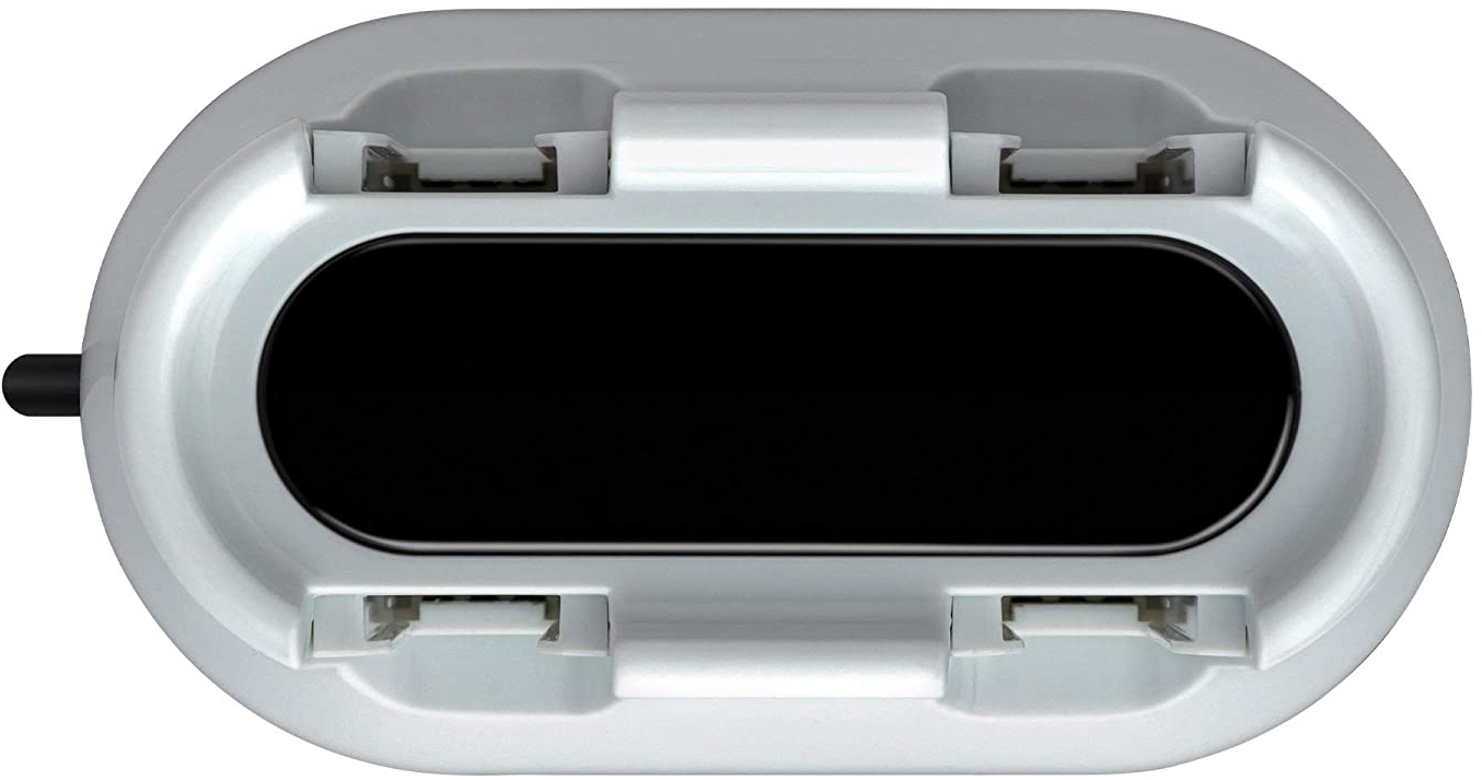 Draufsicht auf ein weißes Nintendo Switch-Dock mit Schlitzen für Controller und einem schwarzen Zentrum.