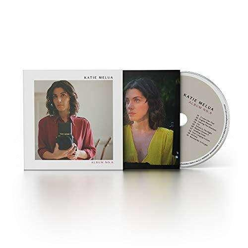 Pochette d'album CD avec Katie Melua sur la couverture et un CD à droite. Fond blanc.