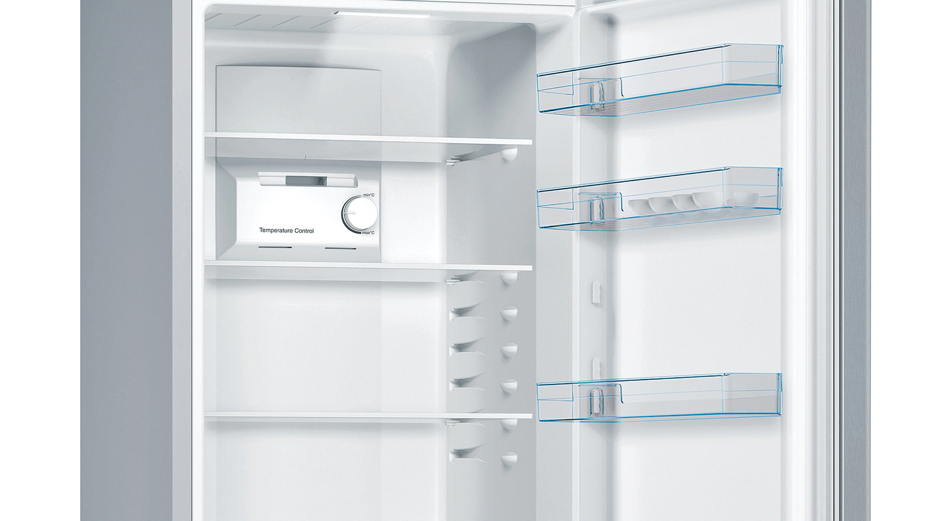 Open refrigerator interior. Shelves, temperature control, and egg holders visible.