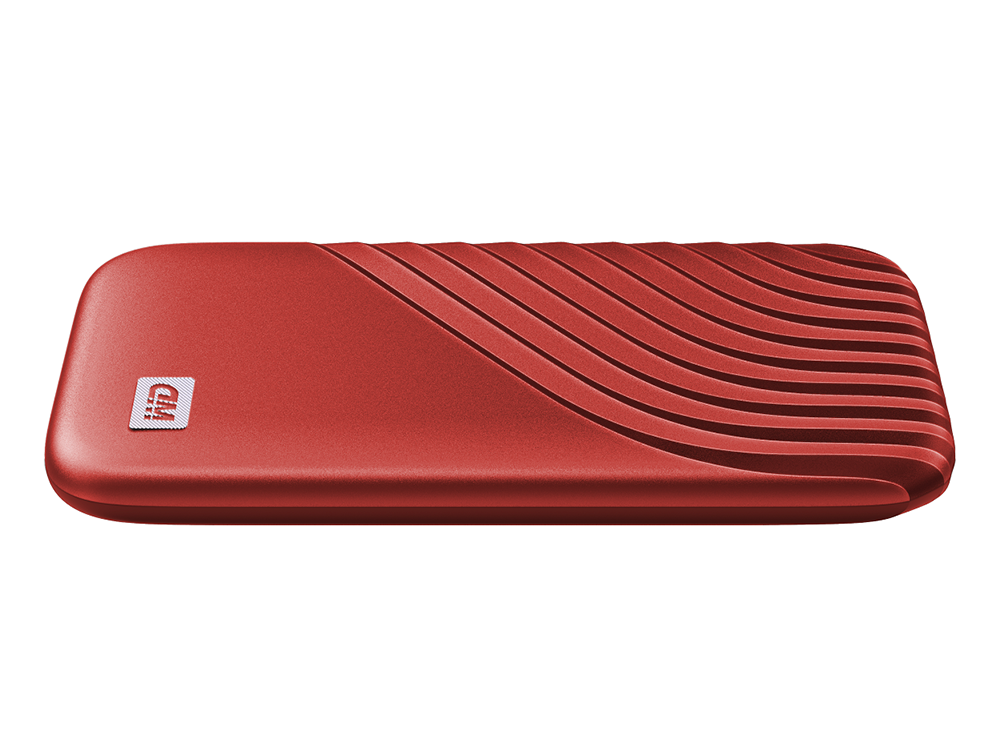 Disco duro externo rojo con diseño ondulado en la superficie superior.