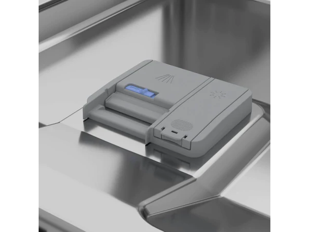 Dispensador de jabón para lavavajillas, plástico gris, dentro de un lavavajillas de acero inoxidable. Botón azul.