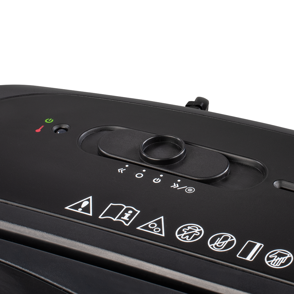 A close-up of a black paper shredder control panel with symbols and a dial.