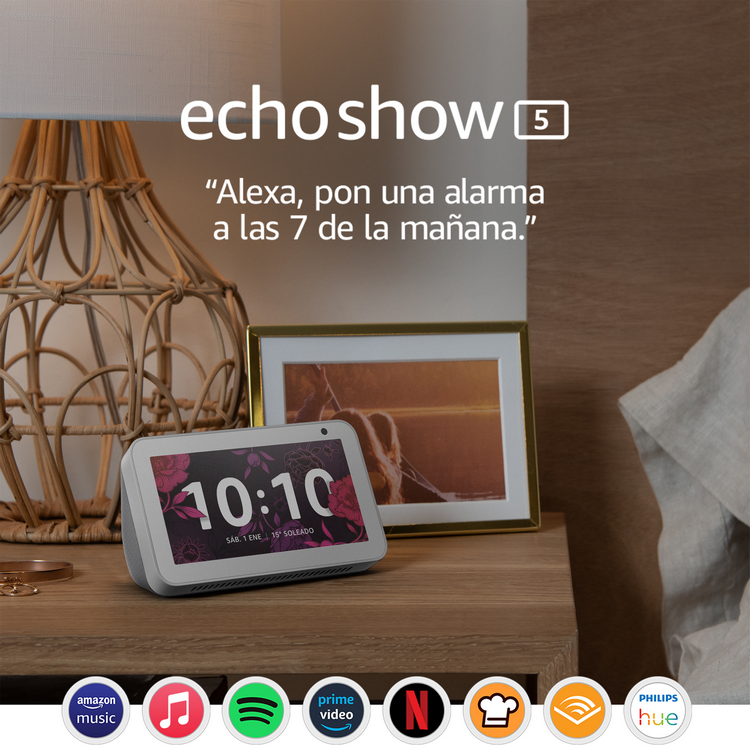 Altavoz inteligente para el hogar con pantalla, sentado en una mesita de noche.
