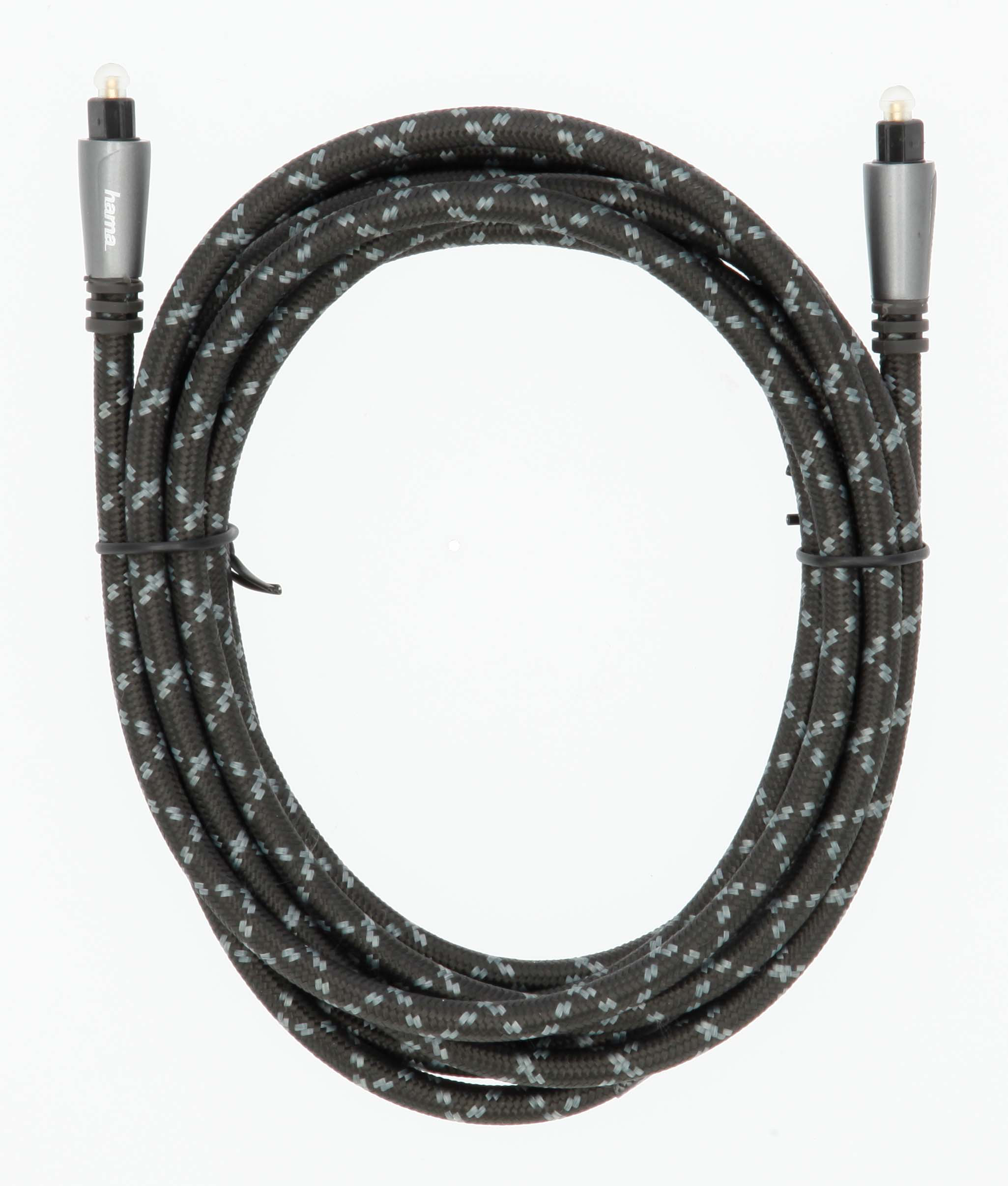 Schwarzes optisches Audiokabel, in einer Schleife aufgerollt, mit silbernen Steckern.