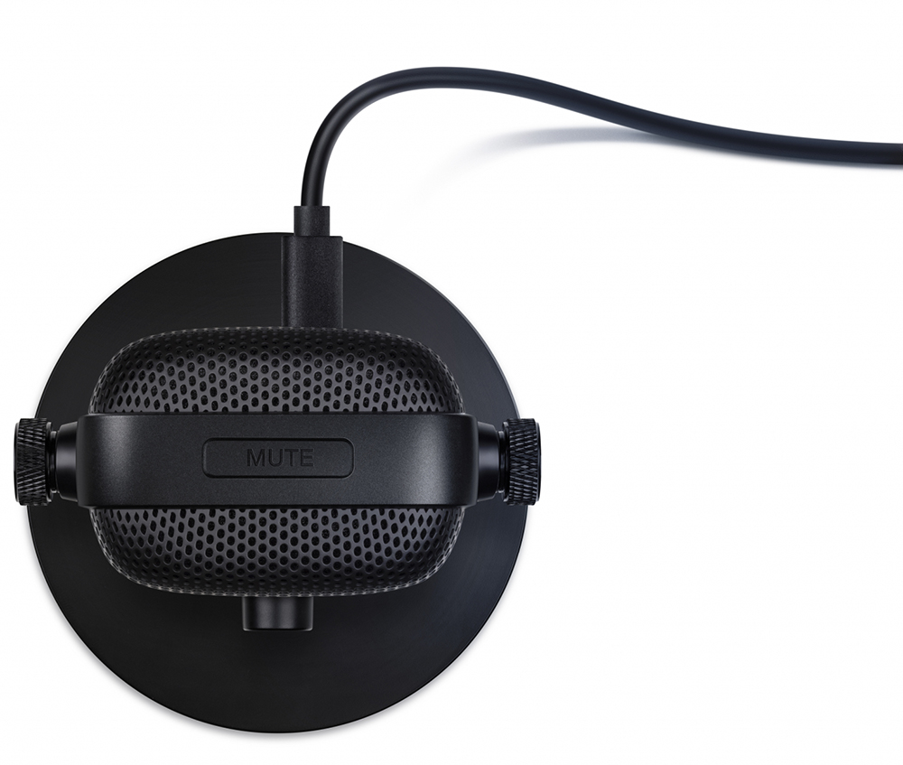 Black microphone with a mute button and a cable. Isolated on white.