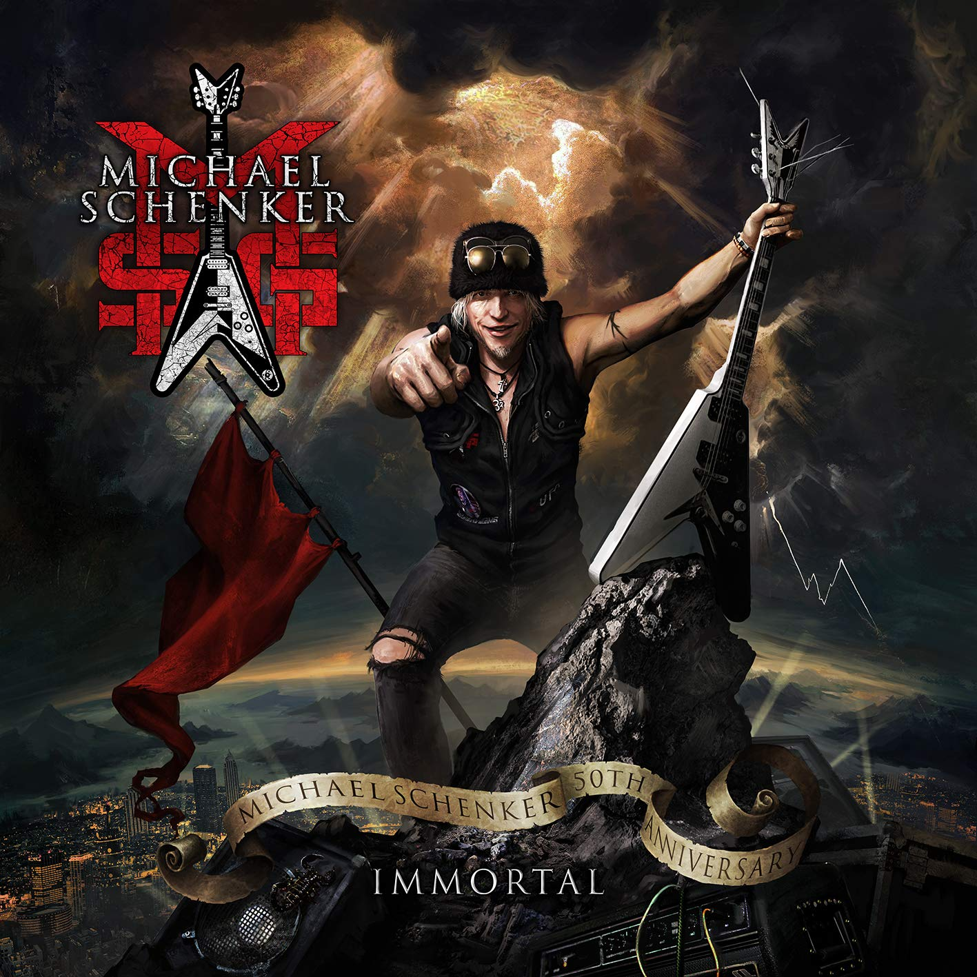 Album borító: Michael Schenker. Férfi gitárral, színpadi fények, piros zászló, város háttér.