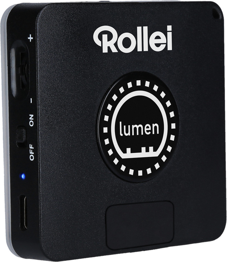 Un Rollei lumen noir avec un cercle blanc, un signe lumen et un port usb.