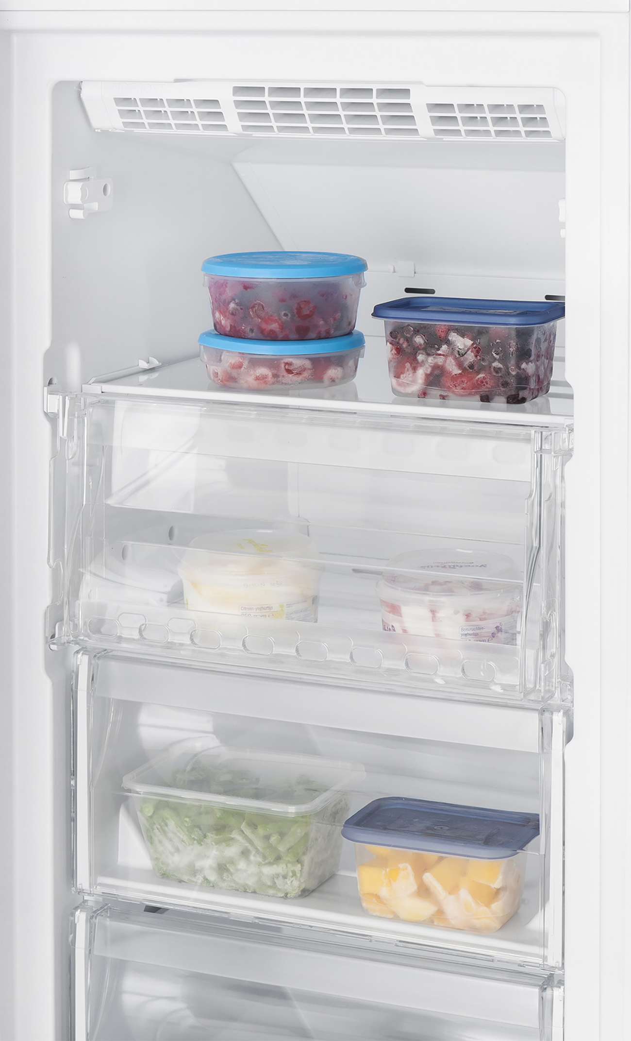 A fridge interior with shelves and drawers containing food items.