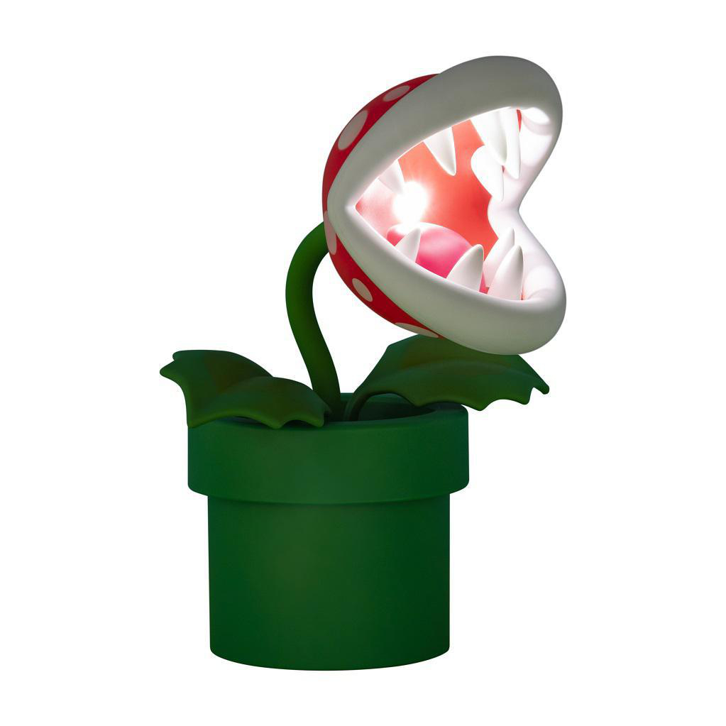Eine Piranha-Pflanzenlampe in einem grünen Topf. Roter Kopf mit weißen Punkten, Zähnen und rosa Innenseite.