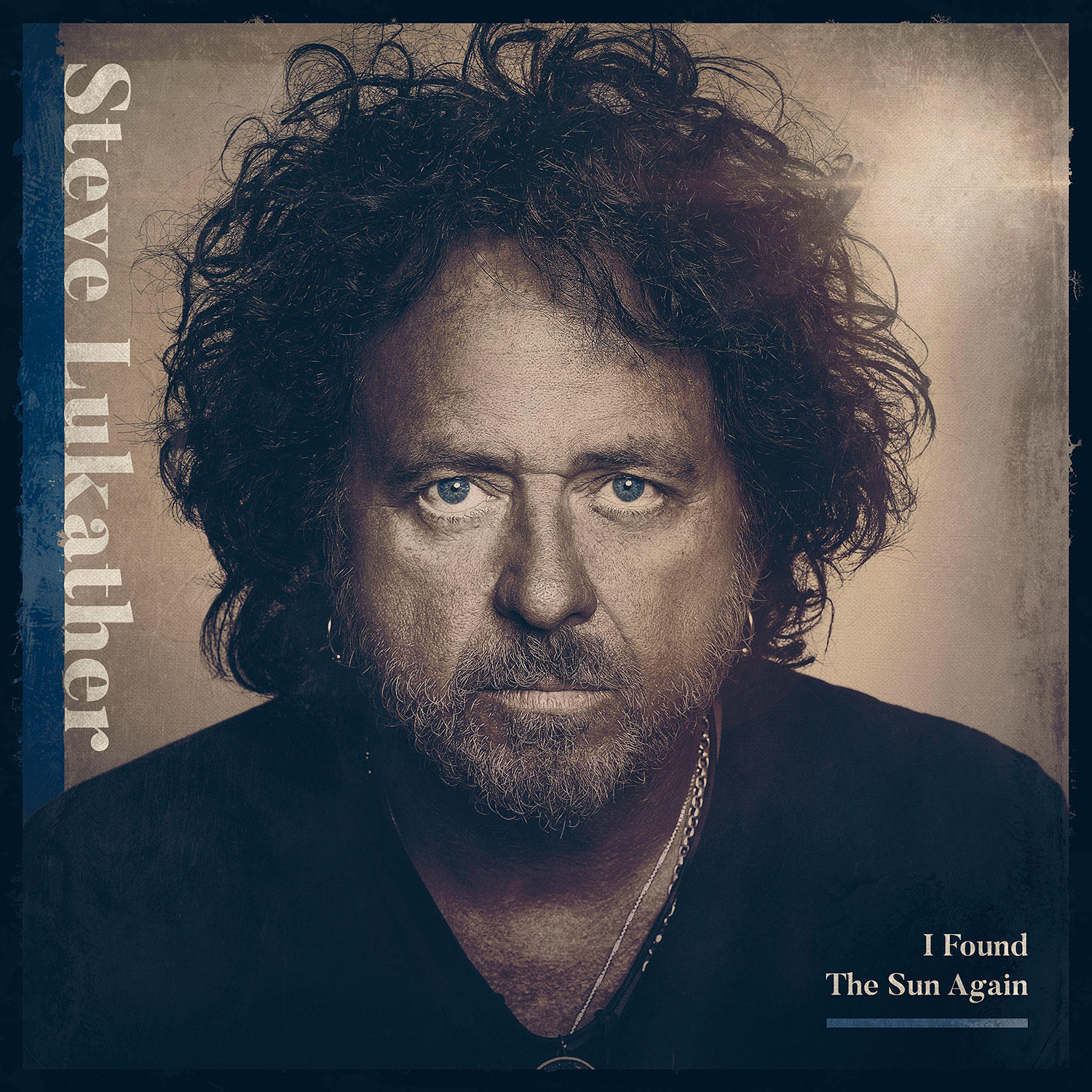 Steve Lukather album borítója. Egy sötét hajú férfi portréja.