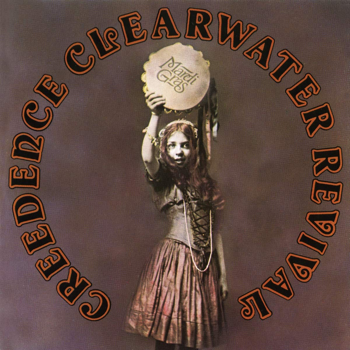 Album borító egy nővel, aki egy tamburint tart. 'Creedence Clearwater Revival' szöveg körben.
