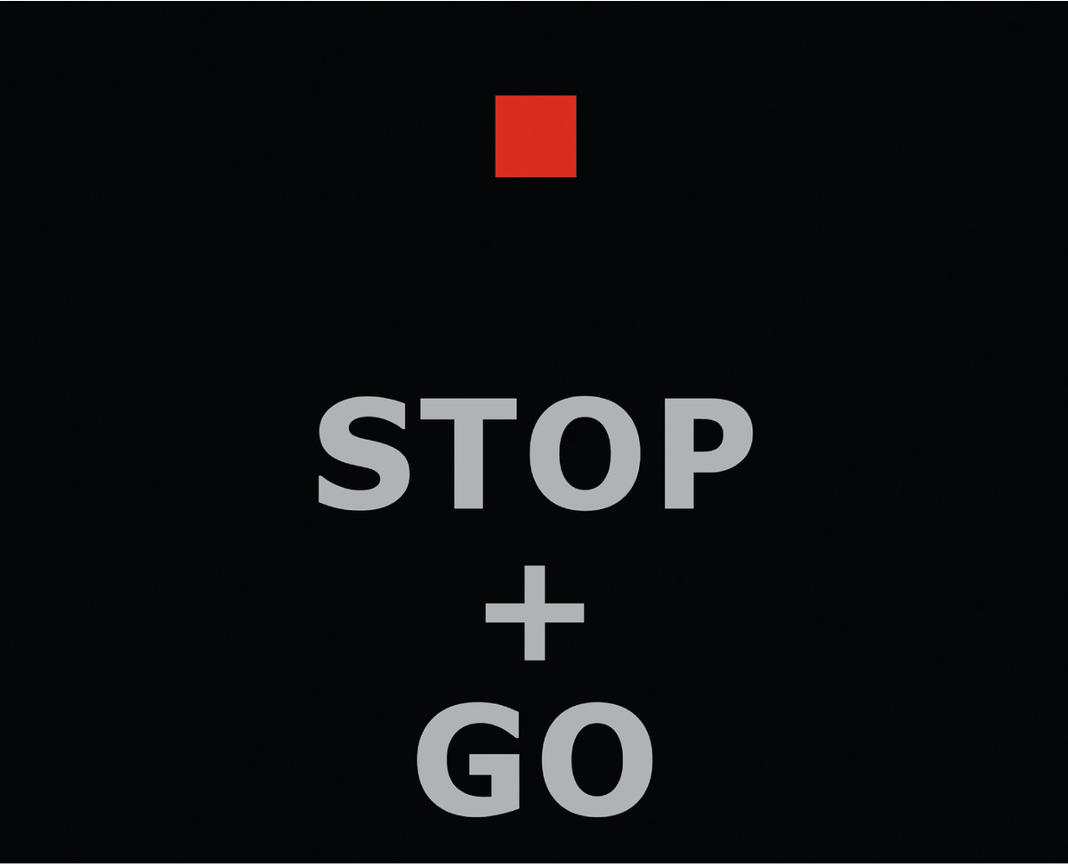 Black background with the words STOP + GO in large, gray letters. A red square is above STOP.