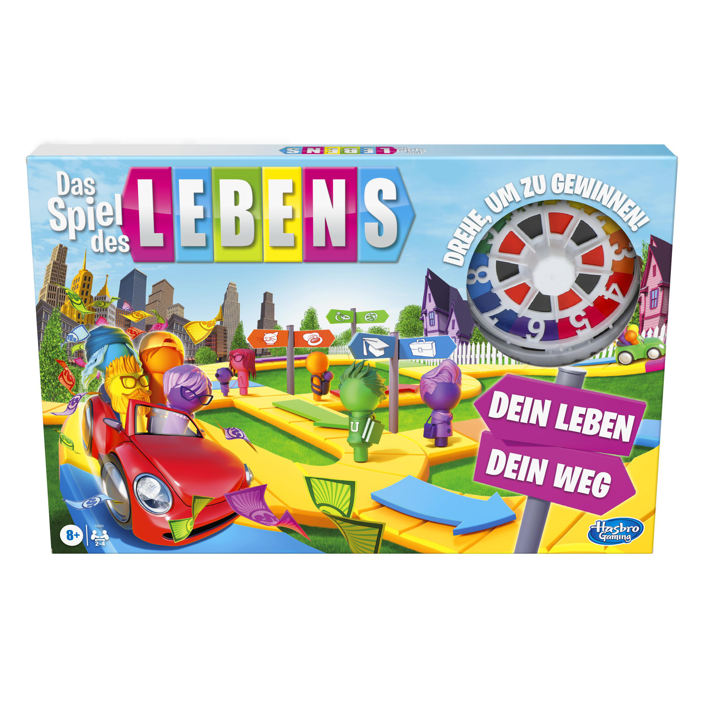 Spielbox mit dem Titel 'Das Spiel des Lebens'. Figuren in einem roten Auto navigieren einen gelben Pfad. Ein Spinner ist in der Ecke.