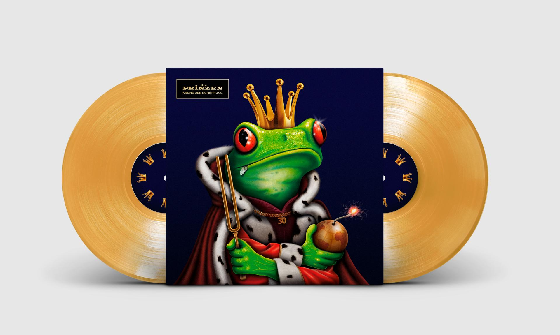 Albumcover mit einem Frosch mit Krone und Bombe. Zwei goldene Schallplatten.