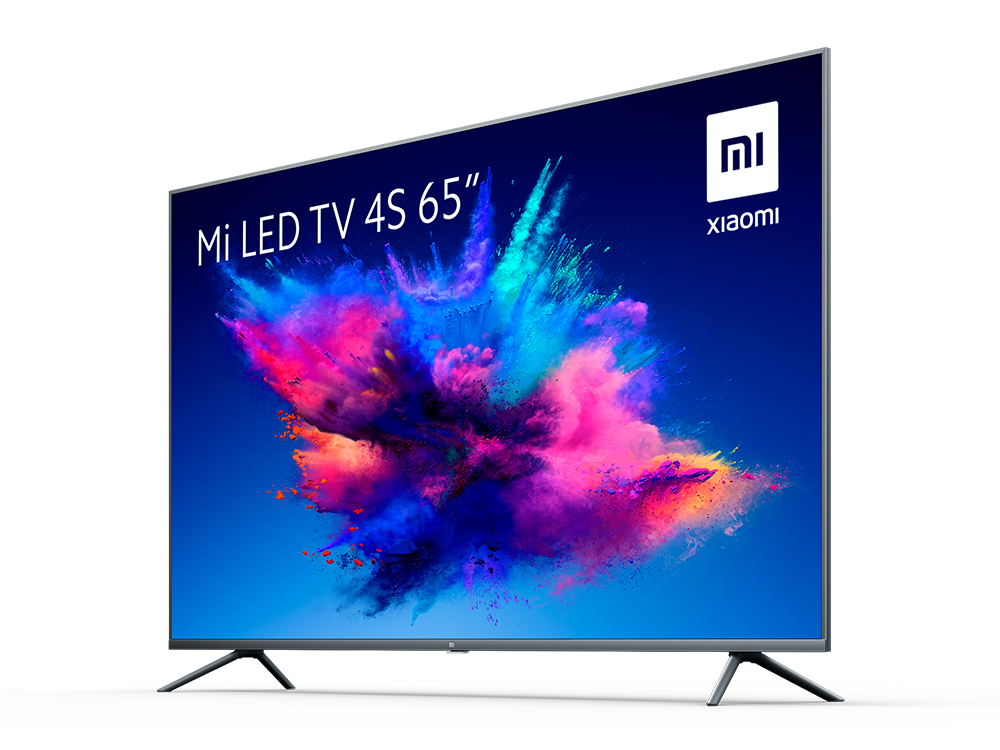 Un televisor de pantalla plana ancha sobre un fondo blanco que muestra una salpicadura colorida.