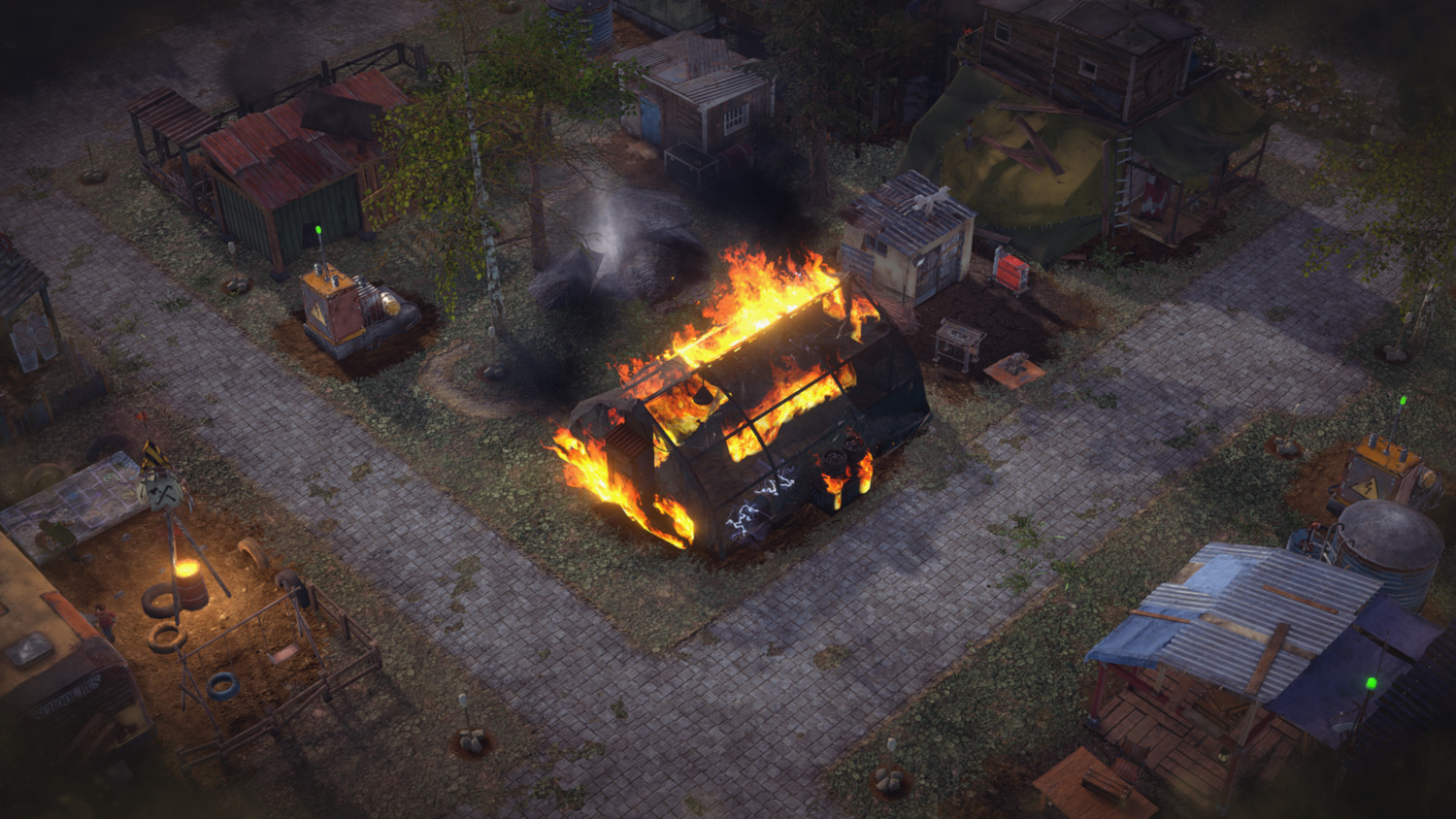 An aerial view of a burning house in a destroyed town. Smoke and fire are visible.