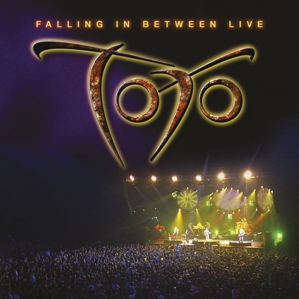 Albumcover. 'Falling in Between Live' ist der Titel. Eine Band auf einer Bühne mit einer Menschenmenge.