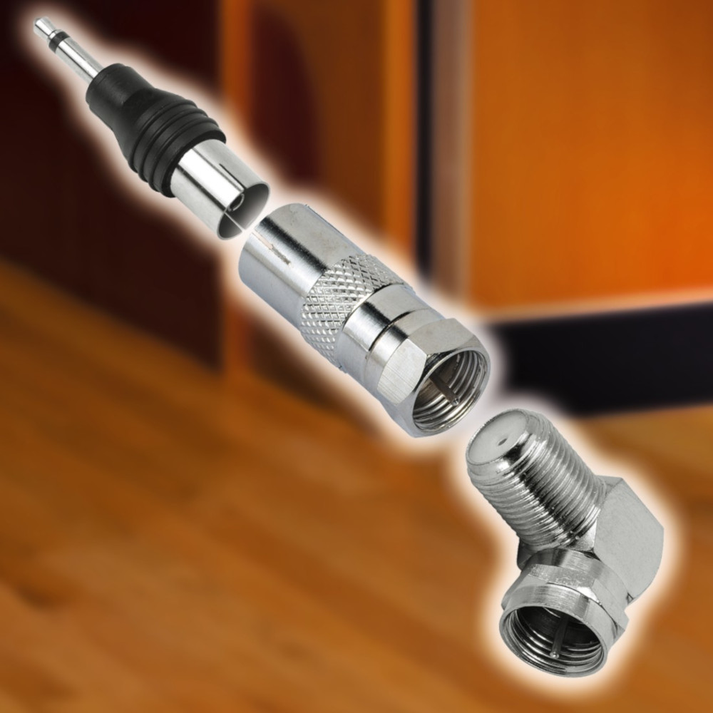 An exploded view of various cable connectors. Silver metallic and black in color. Brown and orange background.