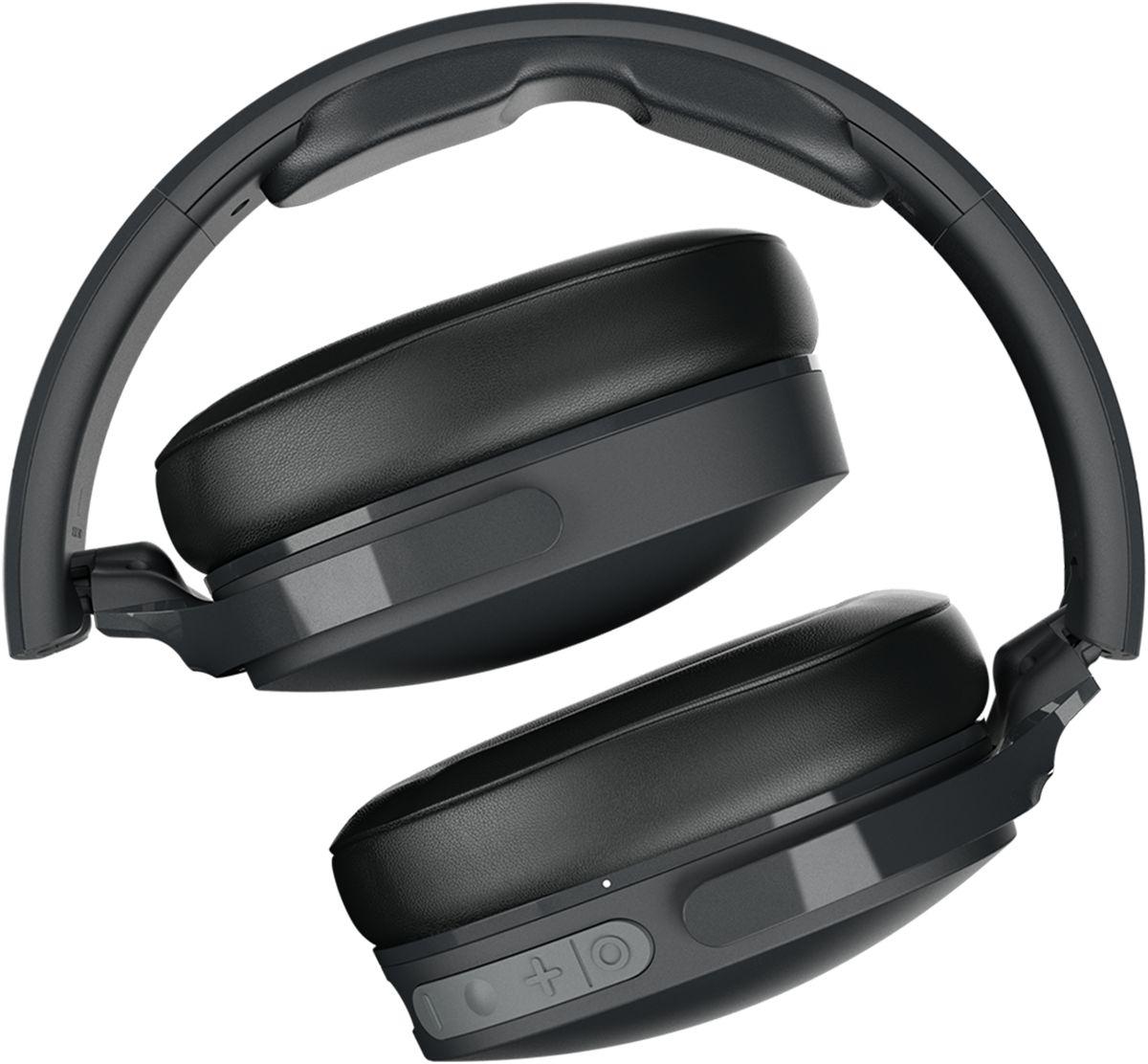 Black, foldable headphones. The ear cups are large, with buttons, on a black backdrop.