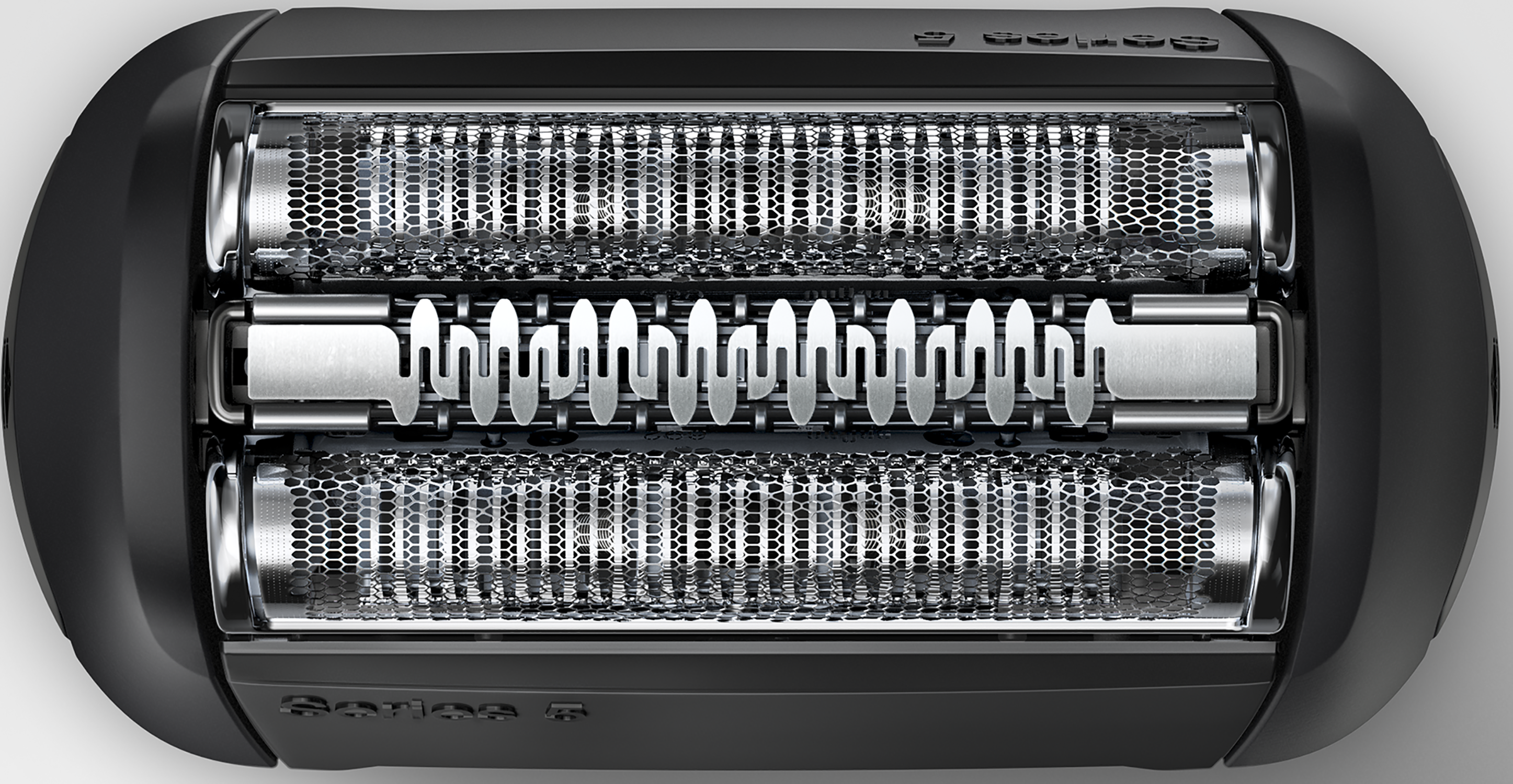 Close-up of a black electric shaver head with three metallic blades.