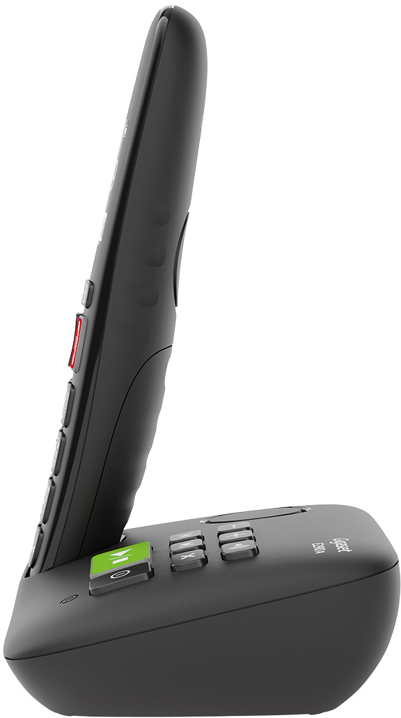 Fekete vezeték nélküli telefon fekete alapon. Gombok és egy zöld gomb található rajta.
