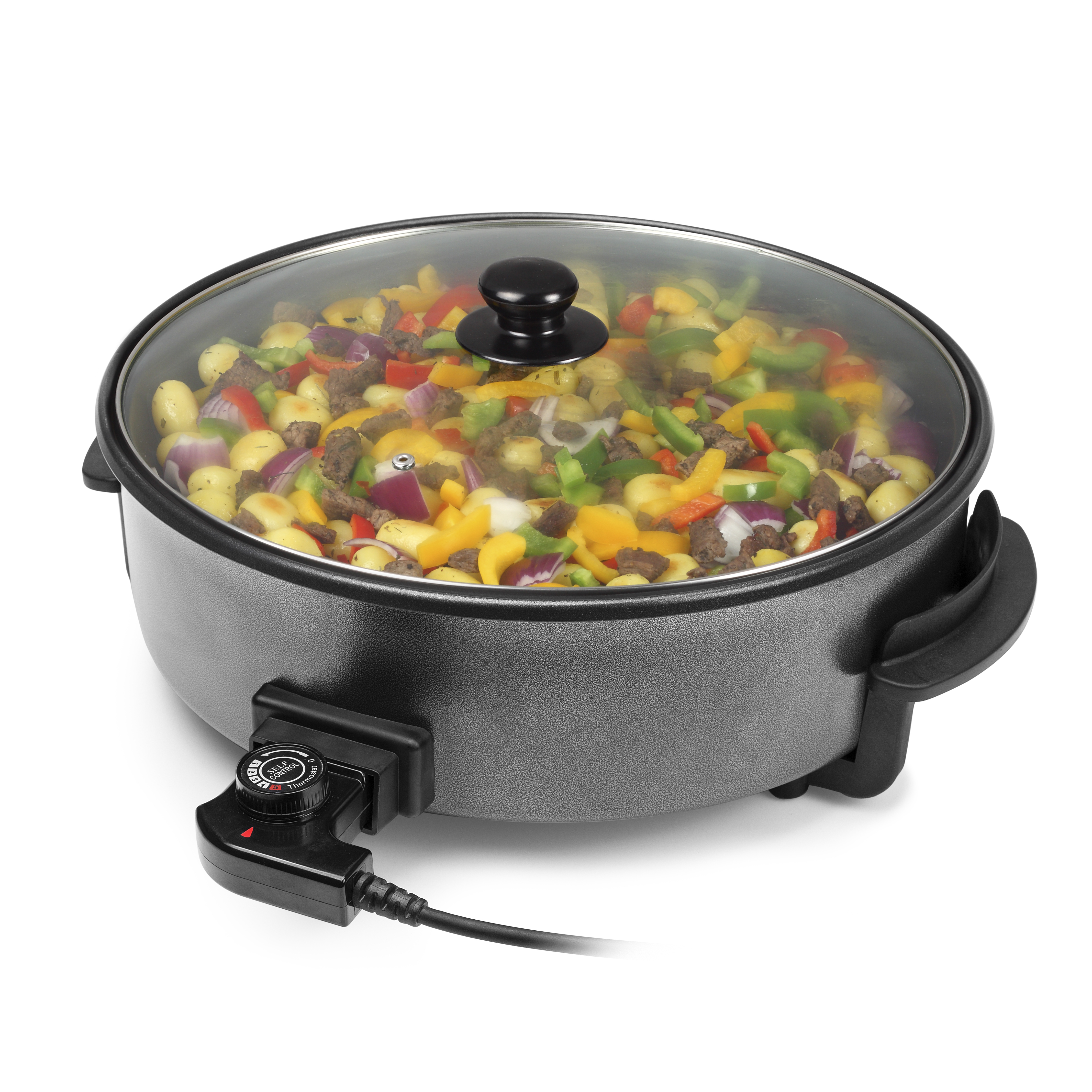Sartén eléctrica con verduras coloridas y ingredientes, con tapa de vidrio.
