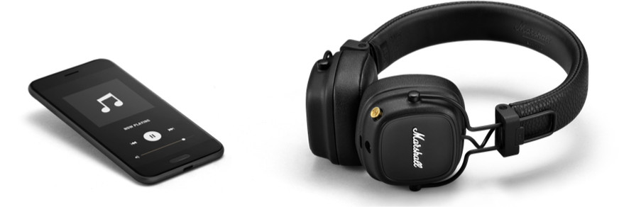 Black headphones and smartphone on white background. The phone displays a music app. Headphones bear the Marshall logo.
