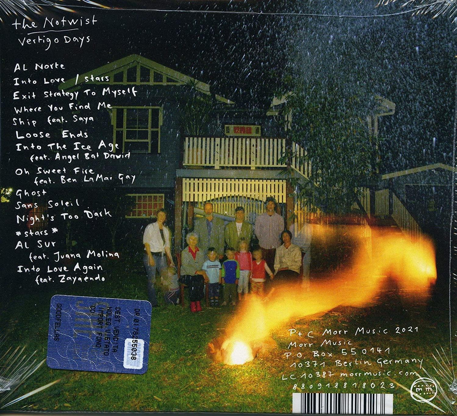 Albumcover mit Haus, Text, Menschenmenge und Feuer. Das Album heißt The Notwist, Vertigo Days.