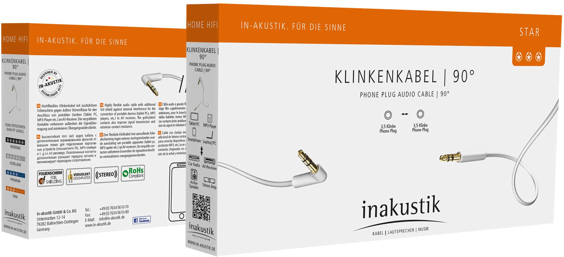 Emballage de câbles audio avec prise téléphonique. Les boîtes sont blanches, noires et or rose.