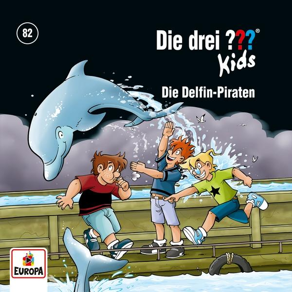 Buchcover, Die drei ??? Kids. Zeigt drei Kinder in der Nähe eines Delfins, Cartoon-Stil.