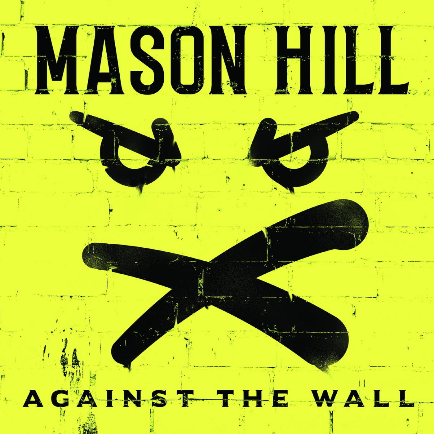 Album borító: Sárga téglás fal dühös arcfestéssel. Szöveg: Mason Hill, Against The Wall.