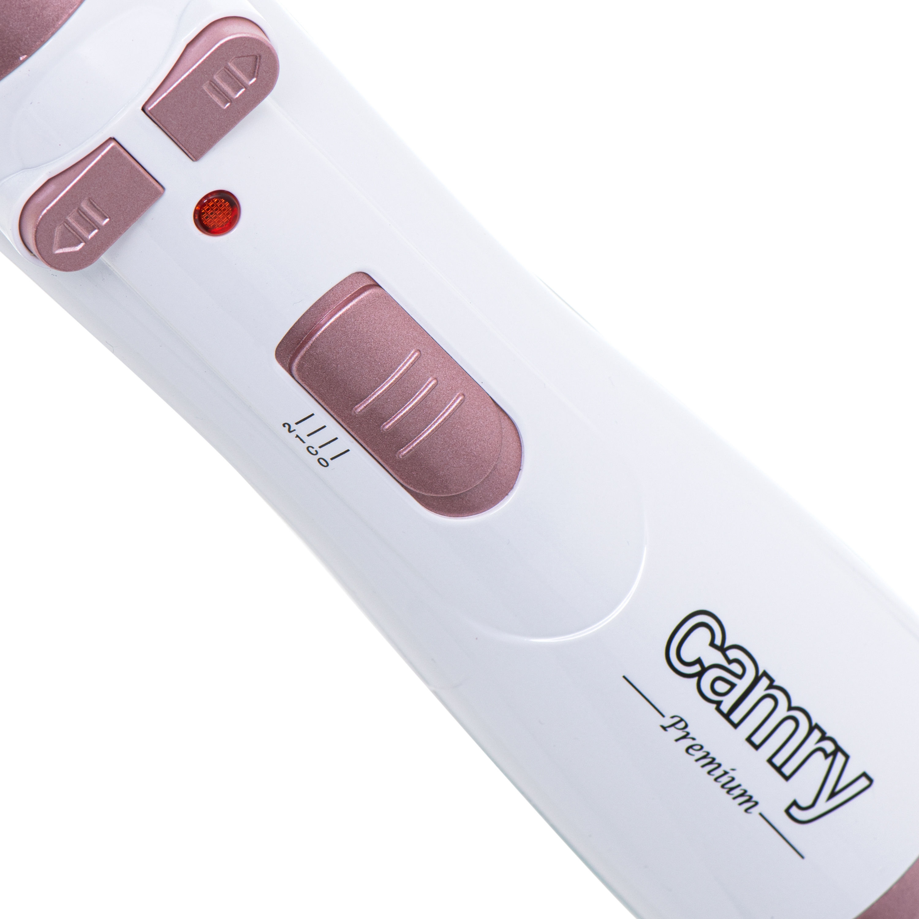 Közelkép egy fehér és rózsaarany hajformázó eszközről gombokkal és egy jelzőfénnyel.