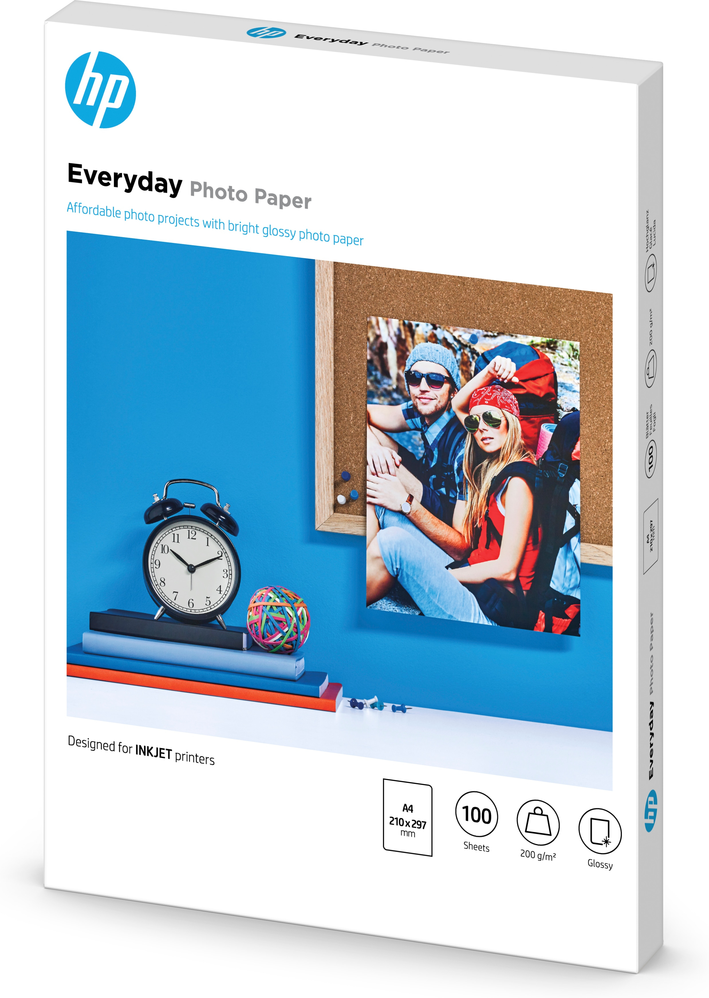 HP Everyday Photo Paper packaging. Image of people in a frame, blue background. Clock and books.
