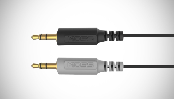 Two black and grey audio jack cables with gold-colored tips.