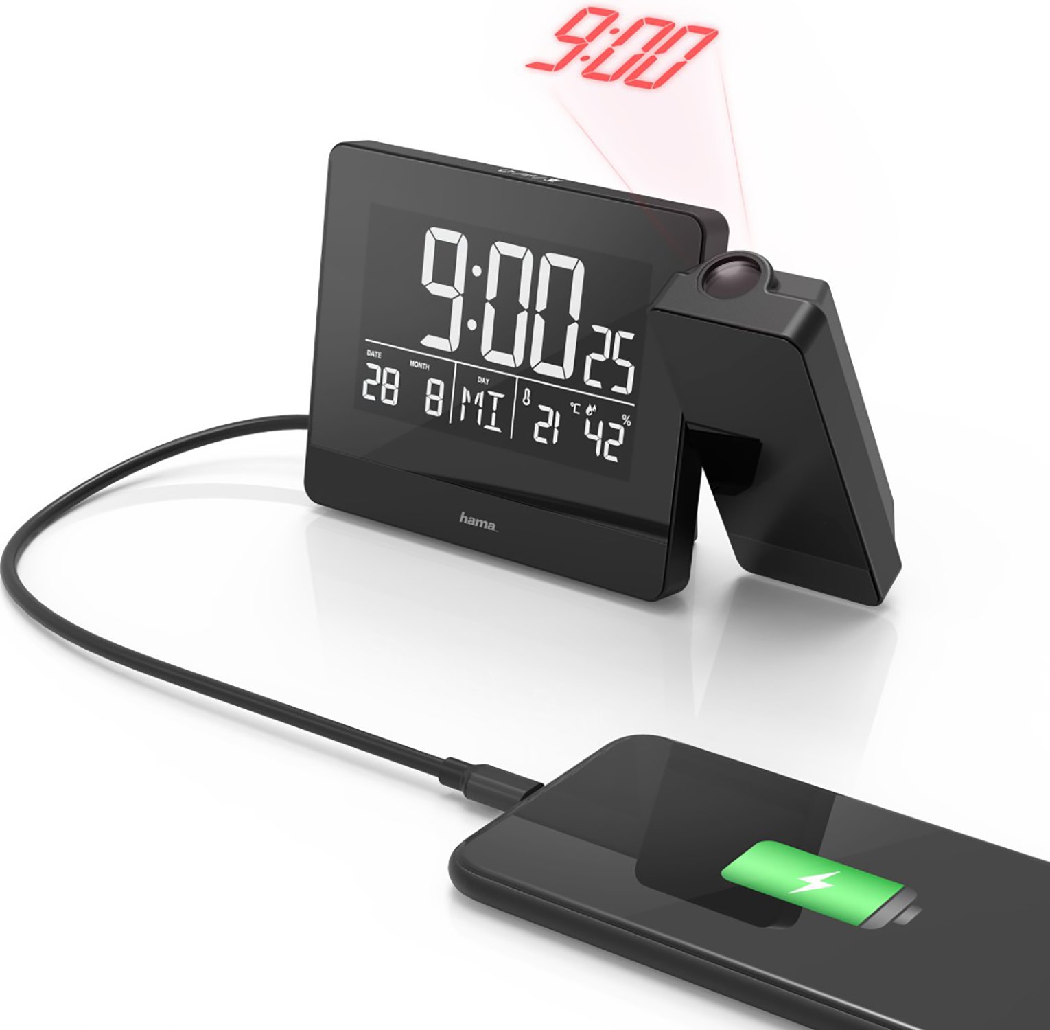 A black digital clock with a smartphone charging.